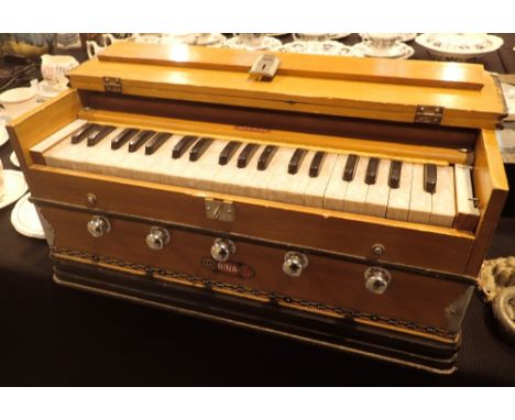 Bina 5 Deluxe harmonium in working order  CONDITION REPORT: Box has expected few knocks and scrapes. All keys appear to work 