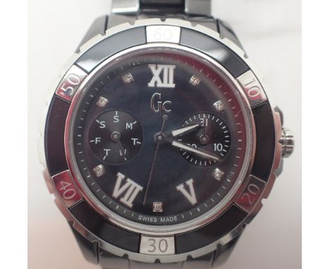 Guess black ceramic ladies wristwatch with black mother of pearl face with seven 0.03ct diamonds