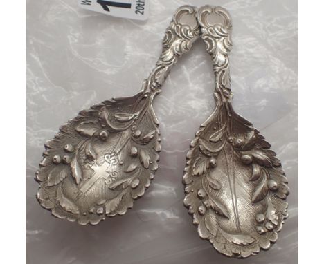 Pair of unmarked silver caddy spoons 