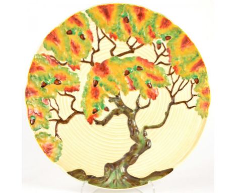 A CARLTON WARE MOULDED PLAQUE WITH AN OAK TREE IN AUTUMN, 32CM DIAM