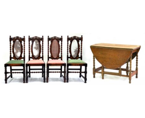 A SET OF FOUR CARVED OAK DINING CHAIRS AND AN OAK GATE LEG TABLE