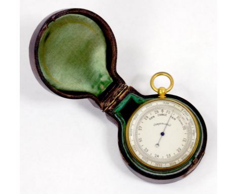A VICTORIAN GILT BRASS POCKET BAROMETER, THE SILVERED DIAL MARKED COMPENSATED, BEZEL 5CM DIAM, PLUSH LINED MOROCCO CASE