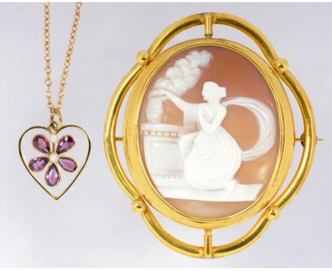 A VICTORIAN CAMEO MOUNTED IN A GOLD BROOCH, THE OVAL SHELL CARVED WITH A CLASSICAL WOMAN AT AN ALTER AND AN EDWARDIAN GOLD, A