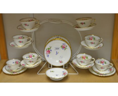 A New Chelsea tea service, decorated with blue bells and pink roses, comprising eight sided plates, nine saucers and eight cu