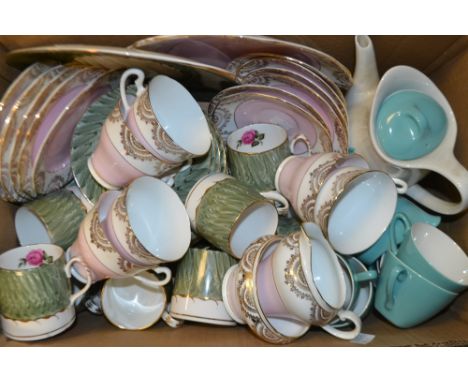 A Springfield part tea service decorated in pink and gilt; a Dakin part tea service decorated in green with rose detail; a Mi