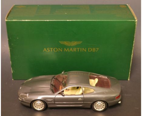 A Gultoy 1:18 scale moderl Aston Martin DB7 model car, square plinth base, boxed with literature.