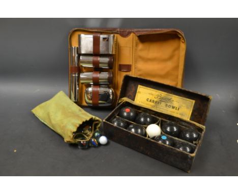 A gentleman's chrome travelling wash  and brush set;  marbles, various;  a set of Banda Carpet bowls (3)