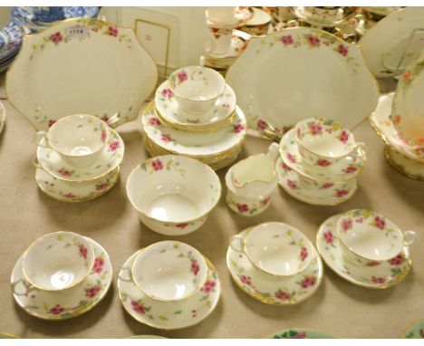 An Aynsley floral tea service comprising, two cake plates, eleven tea plates, seven cups and twelve saucers etc 