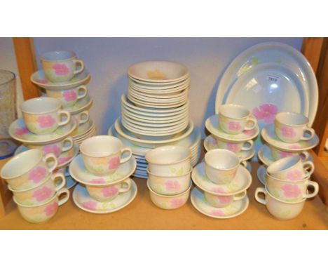 A Poole Pottery Peony pattern eight setting dinner and tea service including dinner, side,dessert plates, oval meat plate, bo