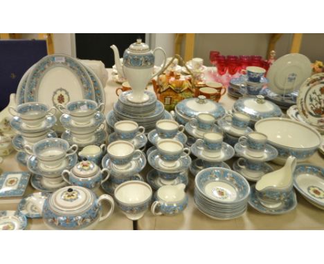 A Wedgwood Florentine dinner service comprising, dinner plates, tea pot, coffee pot, tea plates, cups and saucers, tureens et