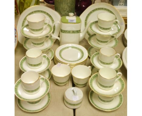 A Royal Doulton Rondelay pattern tea and coffee service including Coffee pot, cups, saucers, two cake/bread plates, etc