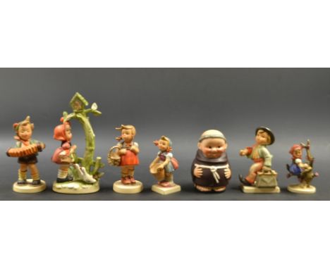 A Goebel pottery figure Merry Wanderer, others accordion boy,  Little Helper, Little Shopper; Apple Tree Girl;  a Monk money 