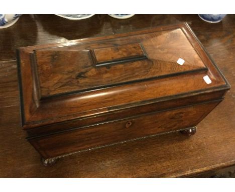 A rosewood tea caddy with hinged top. Est. £30 - £40.