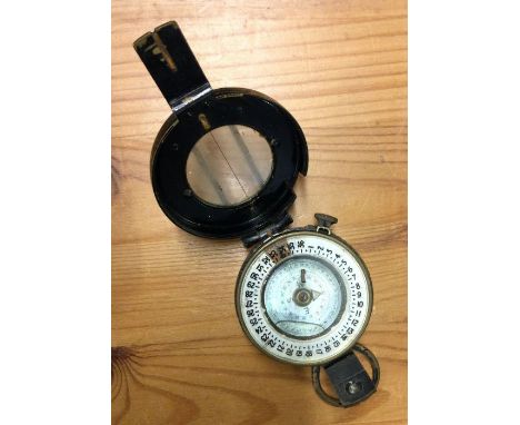 A heavy brass Military compass. Est. £20 - £30.