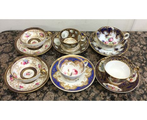 A good collection of six Coalport and other cabinet cups and saucers decorated in bright colours. Est. £20 - £30.