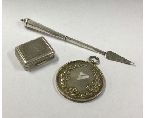 A small engine turned silver pill box etc. Approx. 46 grams. Est. £30 - £40.