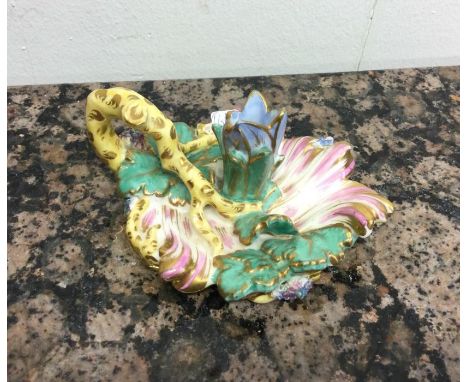 An attractive Victorian porcelain candlestick decorated in bright colours. Est. £30 - £50.