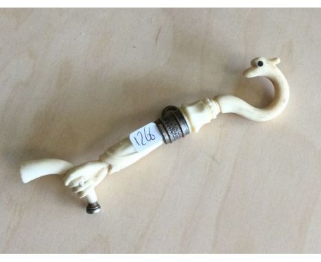 An old ivory pipe. Est. £20 - £30.