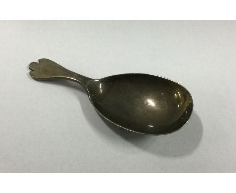 A heavy silver caddy spoon. Birmingham. By GU. Approx. 18 grams. Est. £20 - £30.