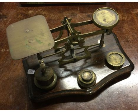 A set of old brass postal scales. Est. £20 - £30.