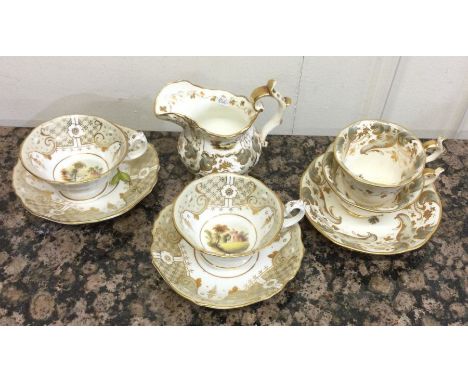 An attractive group of early English porcelain cabinet cups and saucers together with matching cream jug. Est. £30 - £40.
