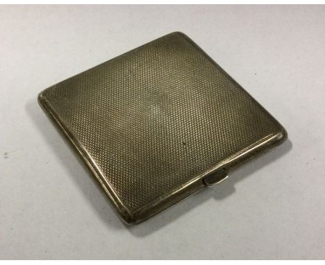 A heavy engine turned silver compact. Birmingham. Approx. 56 grams. Est. £20 - £30.