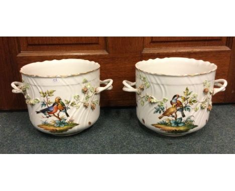 A good pair of Dresden jardinières decorated with birds to gilt rims. Approx. 17 cms high. Est. £50 - £80.