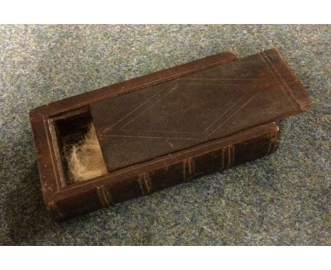An Antique oak carved snuff box with sliding top. Est. £20 - £30.