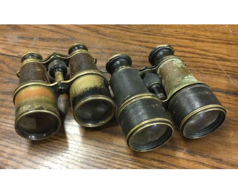 Two pairs of World War I army issue binoculars in leather cases with Military serial numbers. Est. £20 - £30.