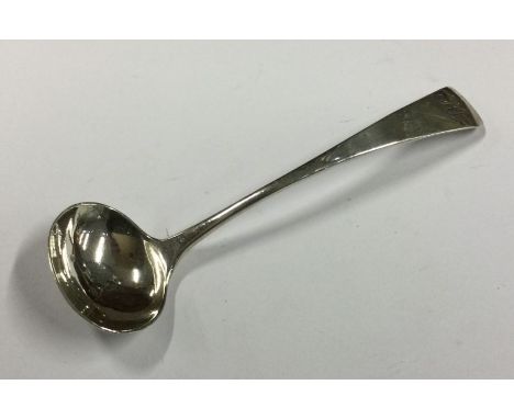 A Georgian silver cream ladle. London. by JL. Approx. 20 grams. Est. £20 - £30.