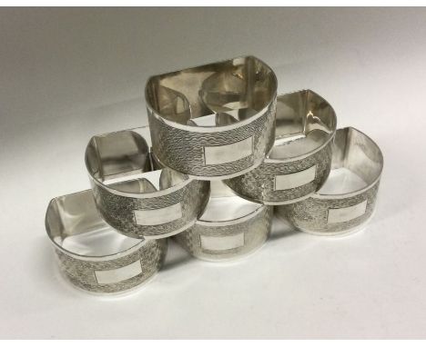 A decorative set of six engine turned silver napkin rings. Birmingham 1973. By Joshua Horton and Son. Approx. 165 grams. Est.