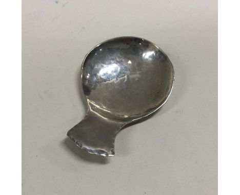 DUBLIN: A rare hammered Irish silver caddy spoon. 1979. By William Egan and Sons. Approx. 20 grams. Est. £30 - £50.