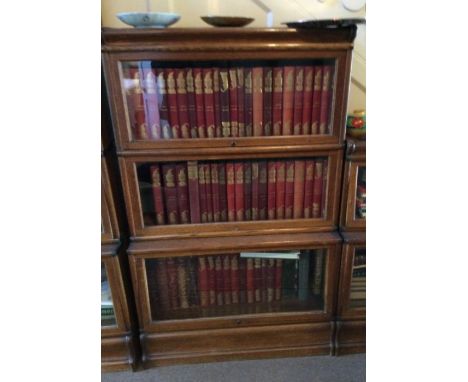 A three section oak Globe Wernicke bookcase. Est. £200 - £300.