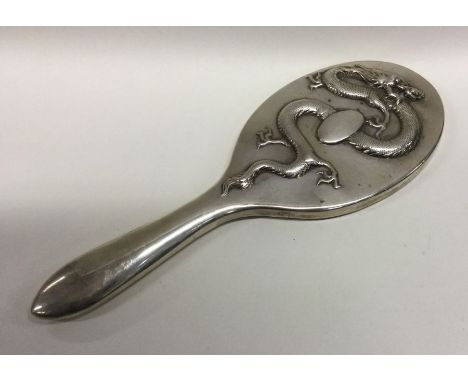 A heavy Chinese silver mirror. Marked to side. Est. £160 - £180.
