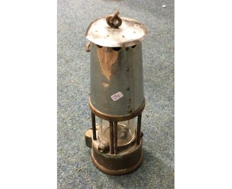 An old Miner's lamp. Est. £20 - £30.