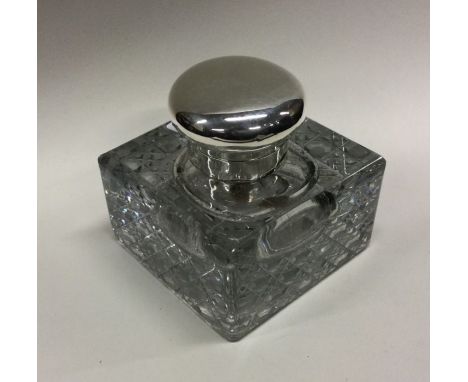 A silver mounted glass inkwell.  Birmingham 1906. Est. £60 - £80.