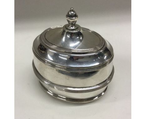 A silver tea caddy of oval form. Marked to base. Approx. 249 grams. Est. £180 - £220.