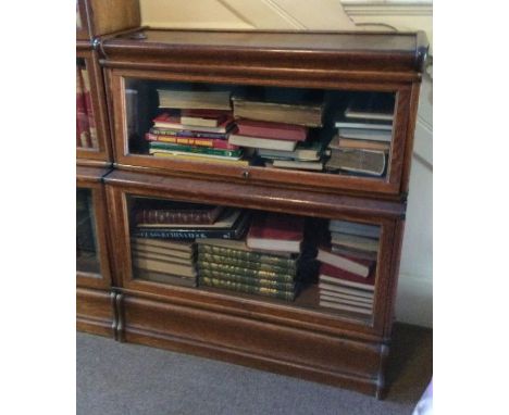 A two section oak Globe Wernicke bookcase. Est. £100 - £150.