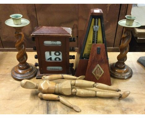 An old metronome, candlesticks etc. Est. £10 - £20.