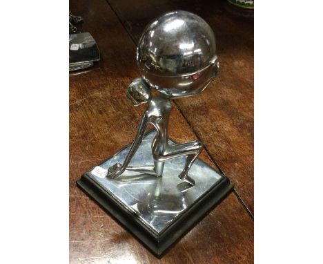 A stylish chrome lighter on stand. Est. £20 - £30.