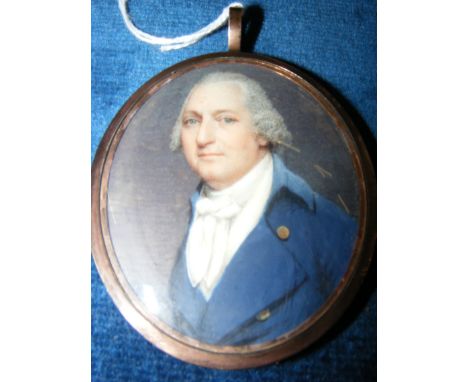 Early 19th century miniature portrait of gentleman in gilt oval frame, having lock of hair to reverse - 7cm x 6cm