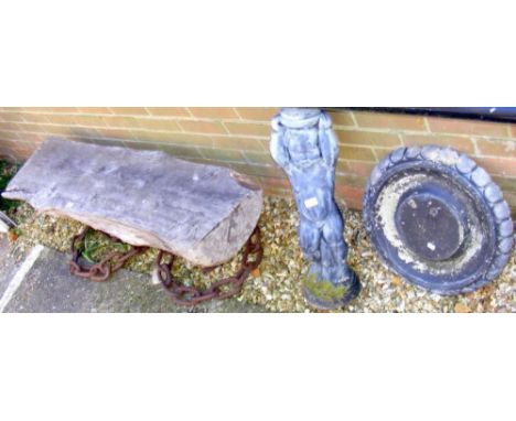 An unusual garden bench, together with a birdbath