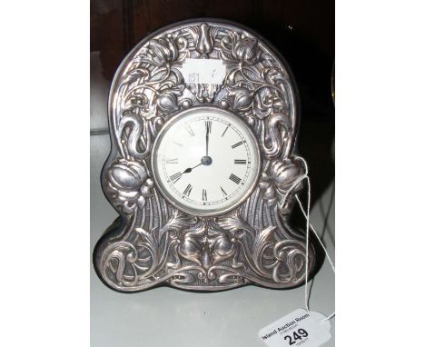 A silver framed mantel clock in the Art Nouveau style - 17cm high