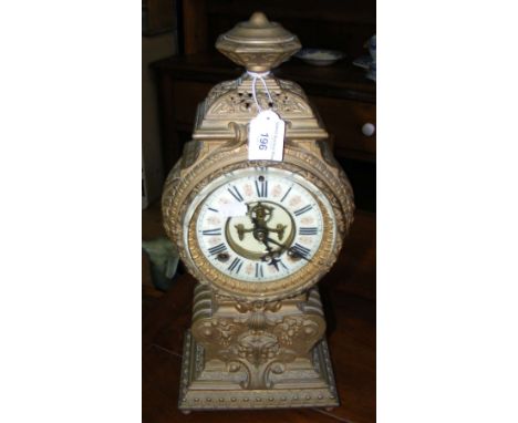 A decorative gilt brass striking mantel clock - 42cm high