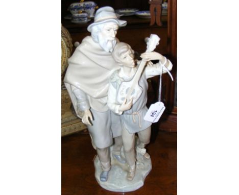 Lladro figure of boy playing mandolin - 36cm high