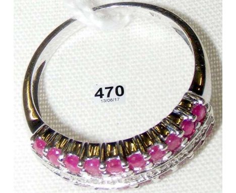 A 9ct gold ruby and diamond half-hoop eternity ring