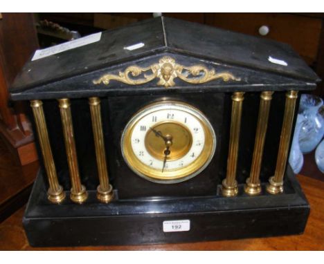 A Victorian mantel clock with Corinthian column design