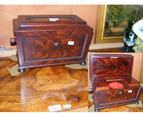 A 30cm sarcophagus shape mahogany two compartment tea caddy