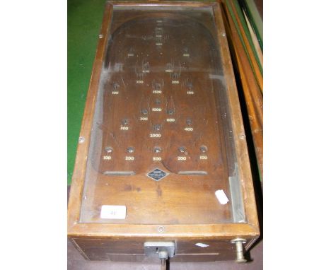 A coin operated table-top "Dwarf" Bagatelle Table