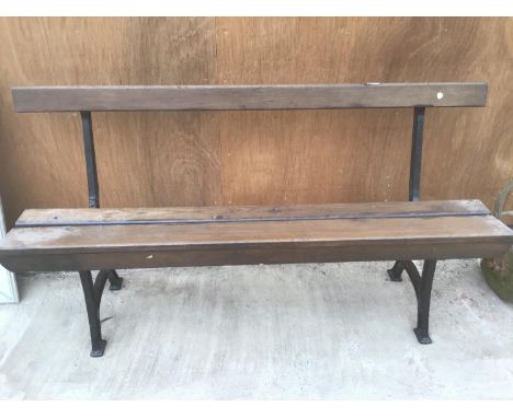 A WOODEN BENCH WITH CAST IRON BENCH ENDS DETAILED WITH 'UNITY WOOD &amp; IRON CO PADIHAM' 157CM LONG 